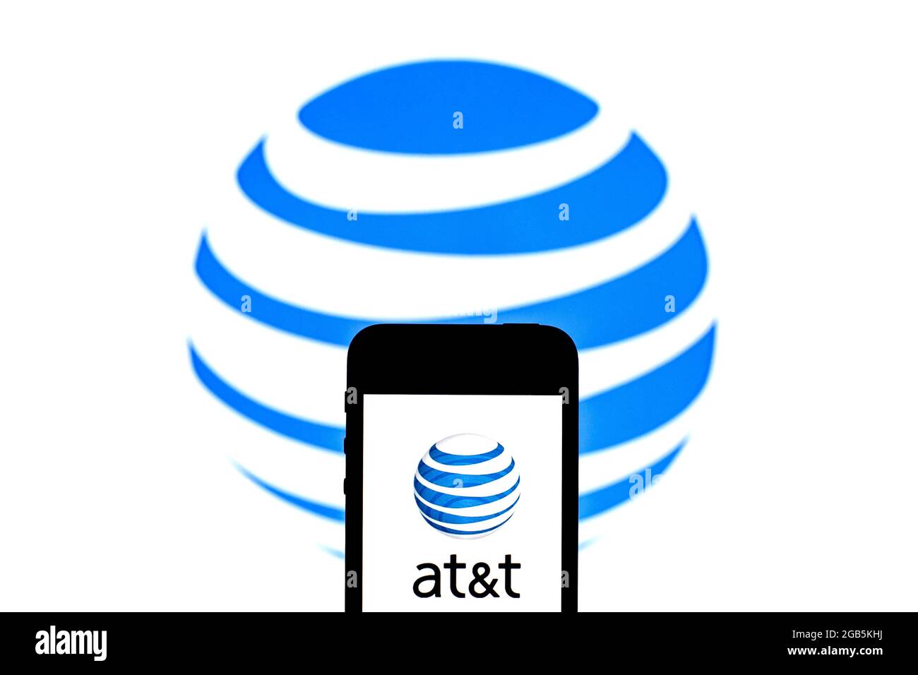 In this photo illustration an AT&T Mobility LLC logo seen displayed on ...
