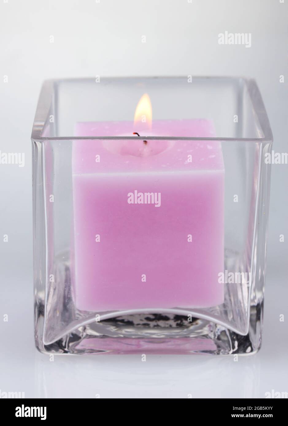 Beautiful purple candle isolated on white Stock Photo Alamy