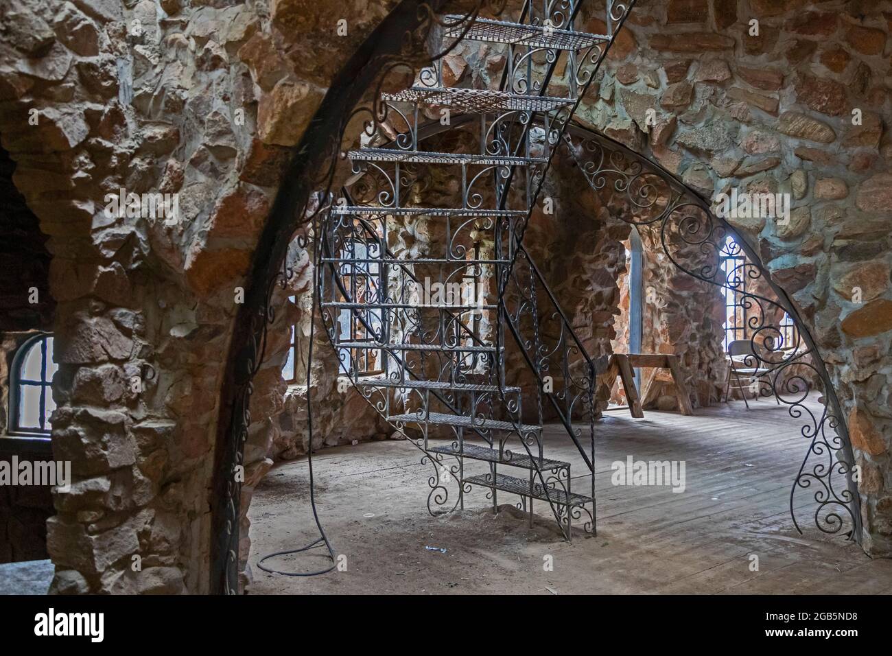 Rye, Colorado - An ornamental iron stairway in Bishop Castle. The Castle is an elaborate stone and metal structure and roadside attraction. It is bein Stock Photo