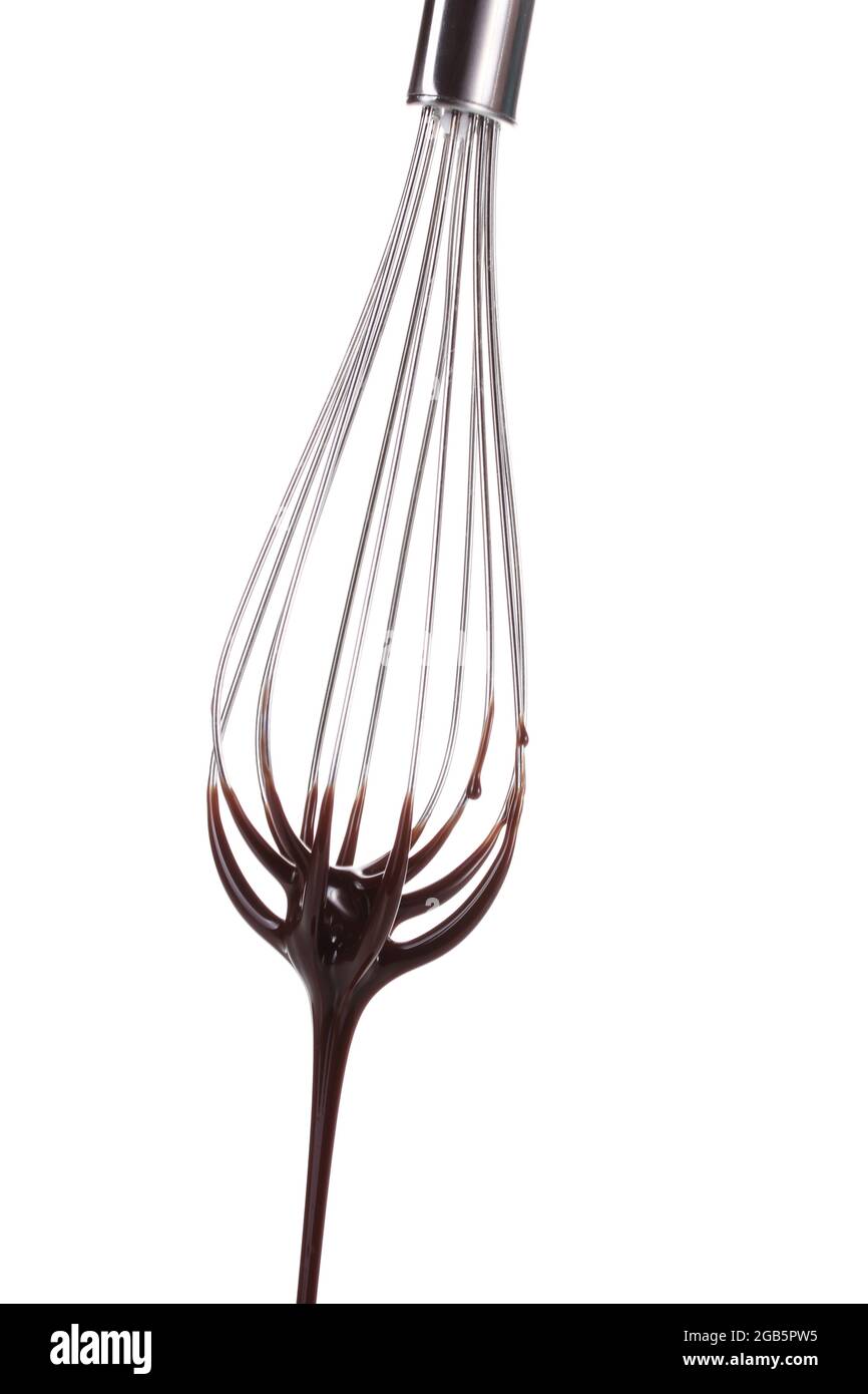 Metal whisk for whipping eggs with chocolate cream isolated on white
