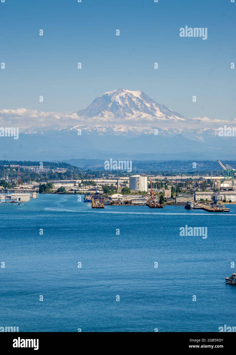 Mount Rainier with little snow in summer and the Port of Tacoma Stock ...