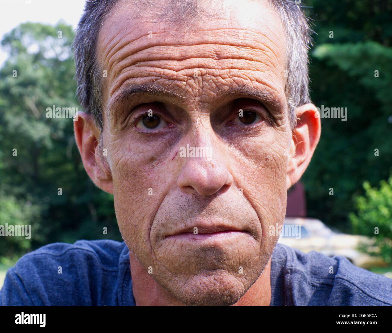 A Close Up of a Middle Aged Male's Facial Expression Stock Photo