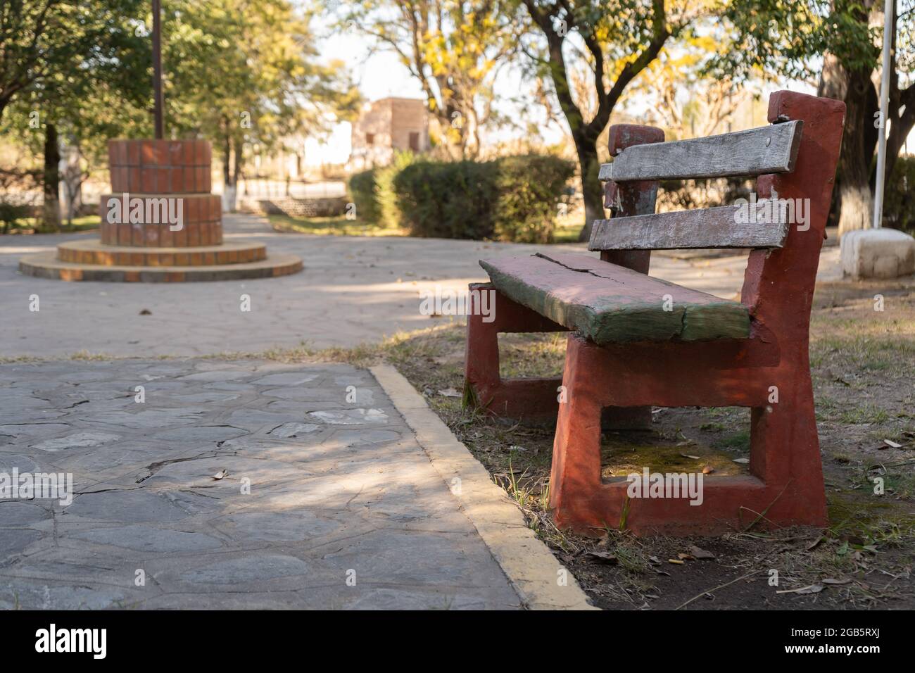 Old empty cement bench in a park. Stone floor Stock Photo