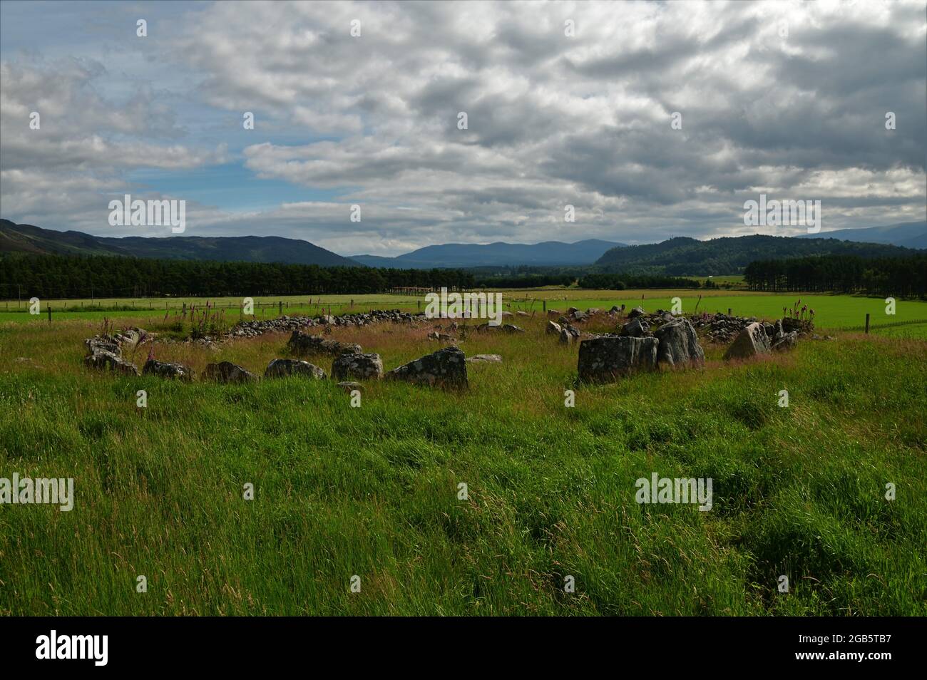 A view of a Neolithic stone circle from the bronze age in a field in Alvie near Aviemore in the Scottish highlands. Stock Photo