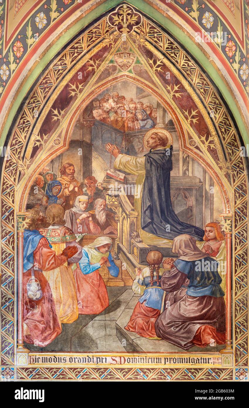 VIENNA, AUSTIRA - JUNI 17, 2021: The fresco St. Dominic presented the Rosary in the Votivkirche church by brothers Carl and Franz Jobst Stock Photo