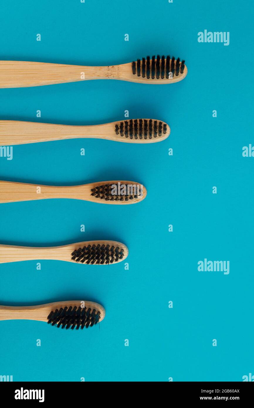 Wooden toothbrush on blue background Stock Photo