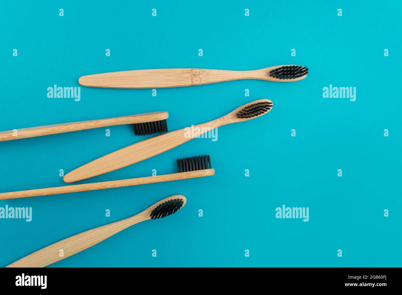 Wooden toothbrush on blue background Stock Photo