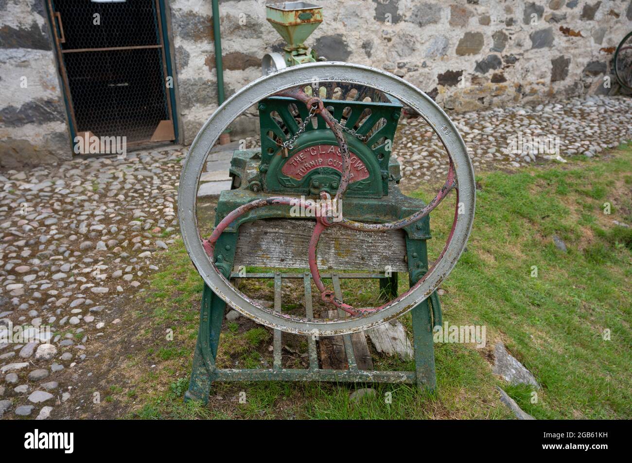 Vintage Glasgow turnip cutter in open air Highland Folk Museum. Rustic