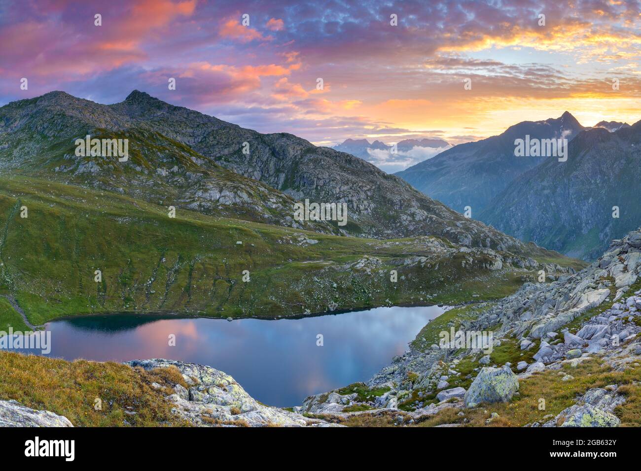 geography / travel, Switzerland, Ticino, Airolo, Colourful sunrise over Lago d'Orsino., ADDITIONAL-RIGHTS-CLEARANCE-INFO-NOT-AVAILABLE Stock Photo