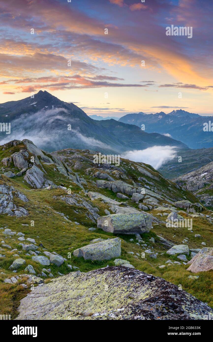 geography / travel, Switzerland, Ticino, Airolo, Colourful sunrise over Gotthard pass., ADDITIONAL-RIGHTS-CLEARANCE-INFO-NOT-AVAILABLE Stock Photo