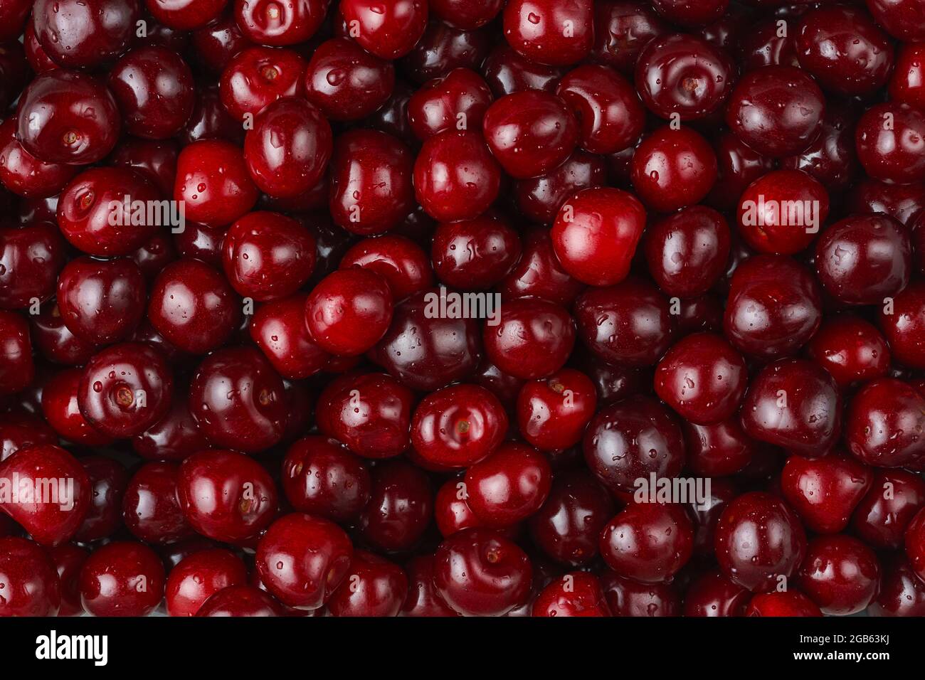 Red cherries texture, seasonal berries. Top view Stock Photo
