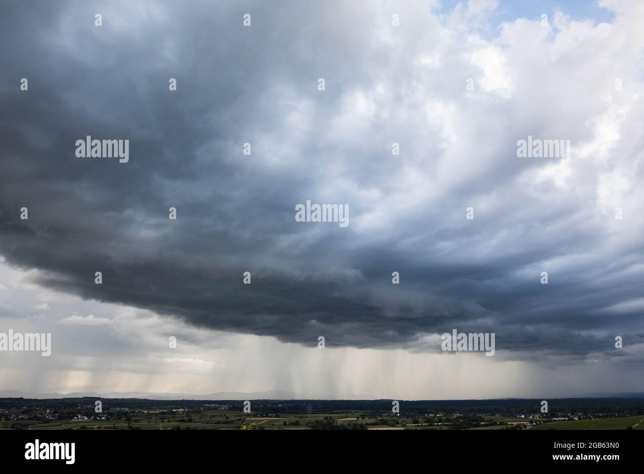 Ehrenkirchen, Germany. 02nd Aug, 2021. An emptying rain front moves over the Rhine valley while in the background the Vosges can be seen. Credit: Philipp von Ditfurth/dpa/Alamy Live News Stock Photo