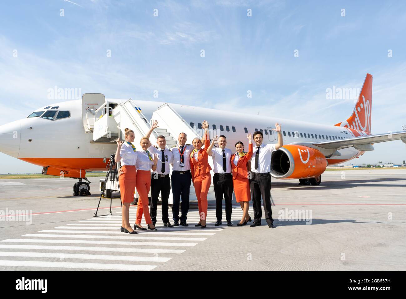 Ukraine, Odessa - July 16, 2021: Pilots and stewardesses on the background of the passenger plane Boeing 737-8Z0 SkyUp Airlines aircraft - UR-SQG at Stock Photo