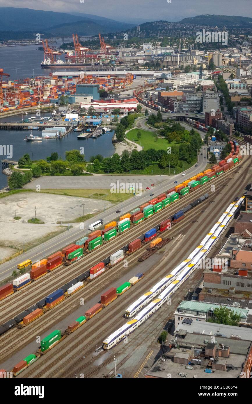 Sea Containers Loaded On Railcars In The Port Of Vancouver Aerial Shot Stock Photo
