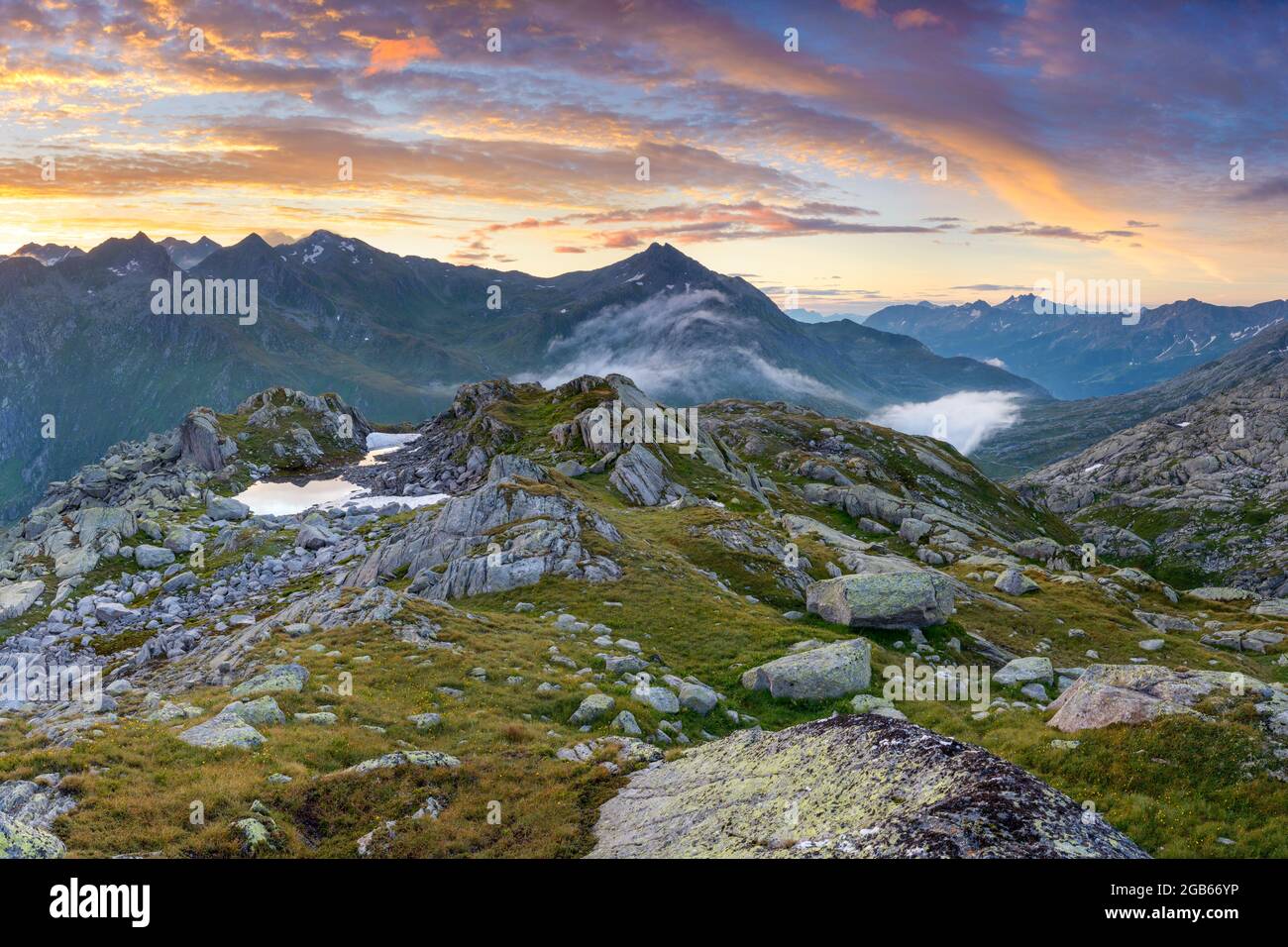 geography / travel, Switzerland, Ticino, Airolo, Colourful sunrise over the Gotthard pass., ADDITIONAL-RIGHTS-CLEARANCE-INFO-NOT-AVAILABLE Stock Photo