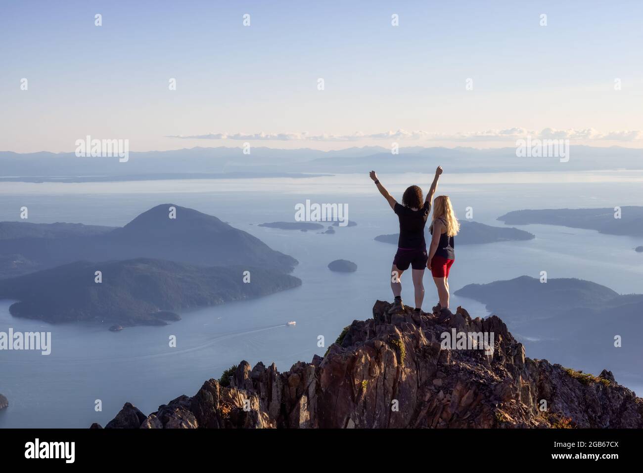 Adventurous Caucasian Woman Friends Hiking on top of a Rocky Mountain ...