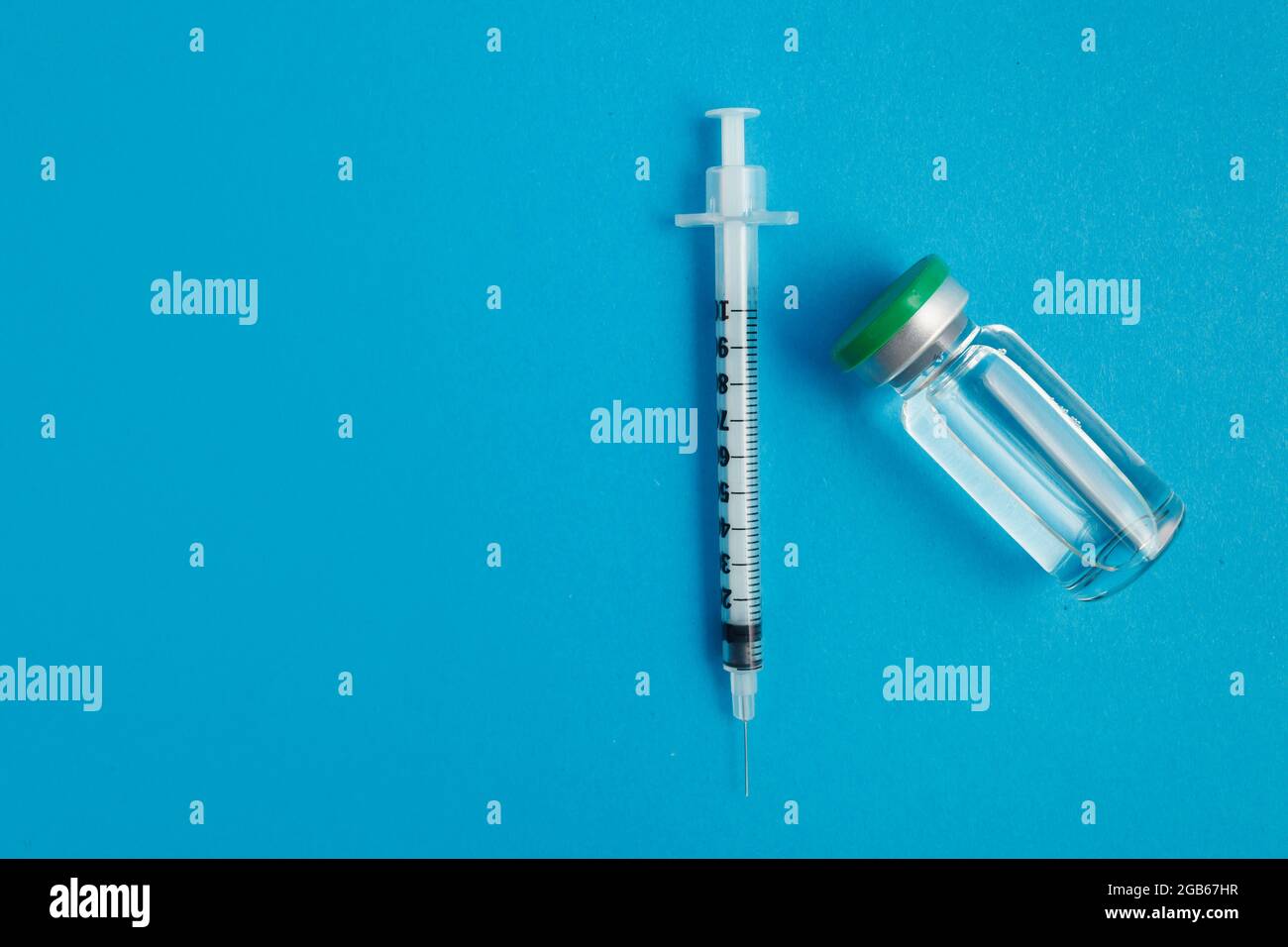 syringe ampoule with medicine on blue background Stock Photo Alamy