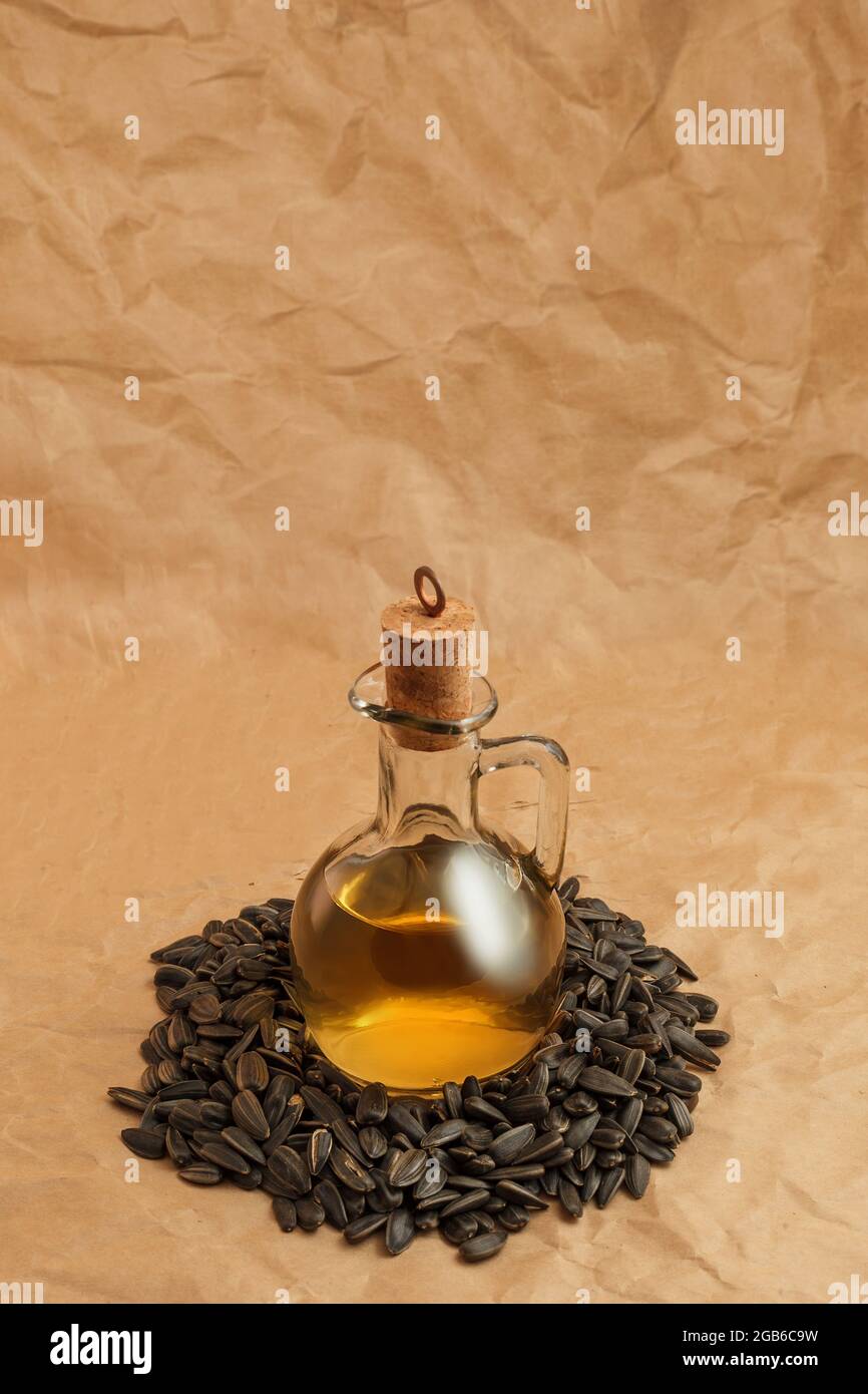 decanter with sunflower oil on seeds Stock Photo