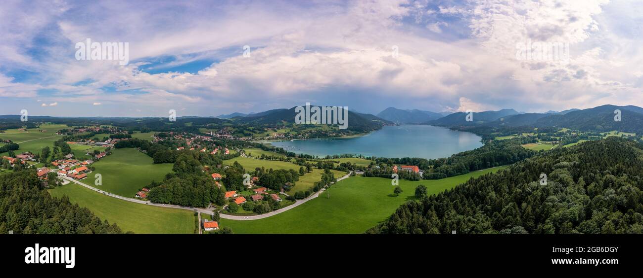 Bavarian recreation area of the Tegernsee, the view at the alps from a high angle view of a drone at a beautiful summer day with the Gut Kaltenbrunn Stock Photo