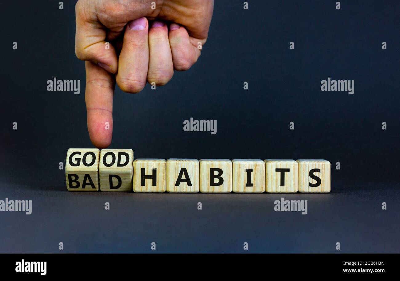 Good or bad habits symbol. Businessman turns wooden cubes and changes ...