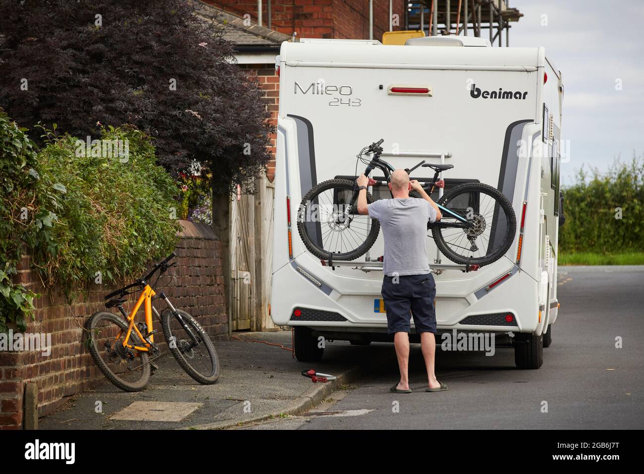 Loading up a RV camper van moterhome with bikes on a bike rack Stock Photo