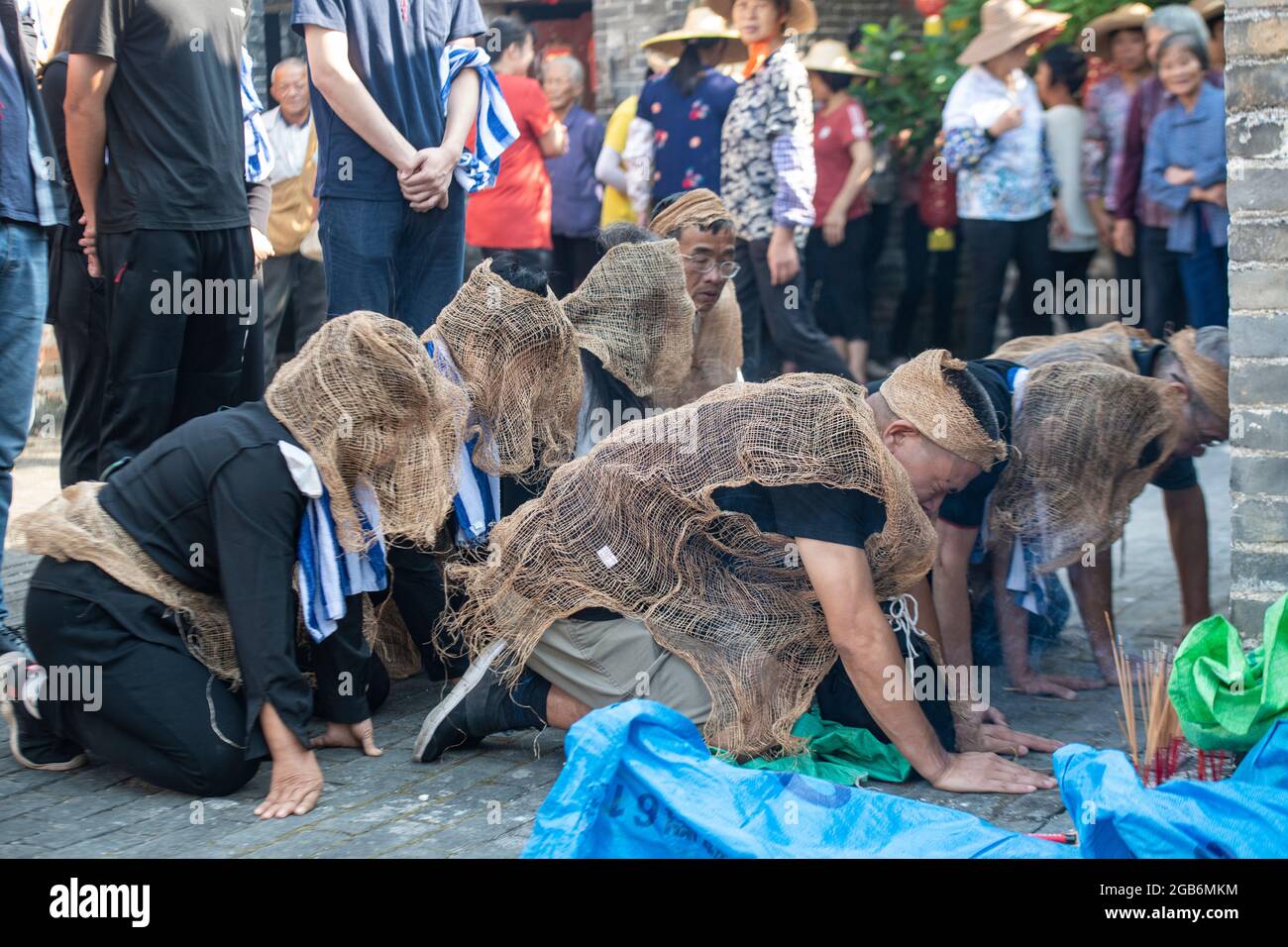 Mourners at a funeral in a rural village in China Stock Photo