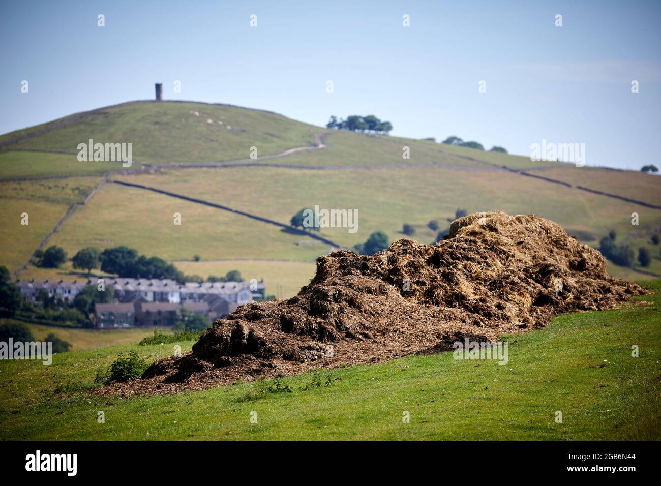 The countryside around Barrowford village in Lancashire, a pile of dry manure in a field Stock Photo
