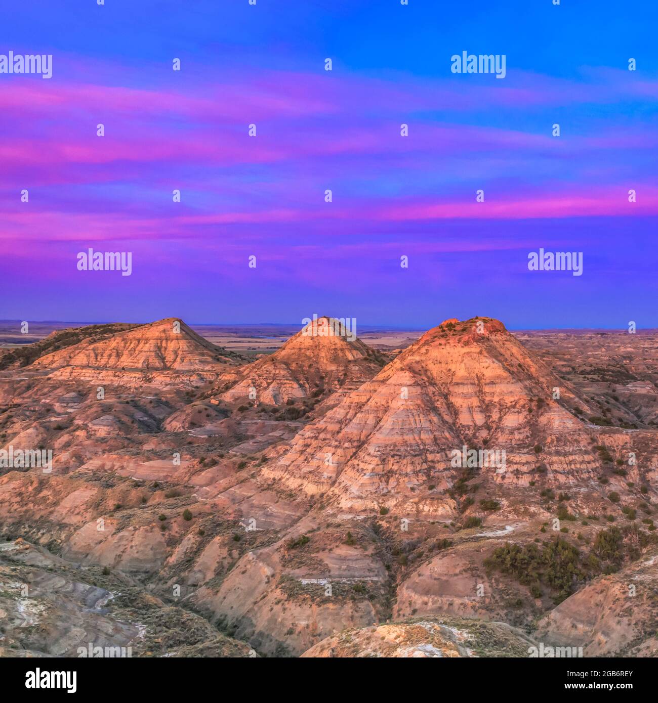 sunrise over haystack buttes in the terry badlands near terry, montana