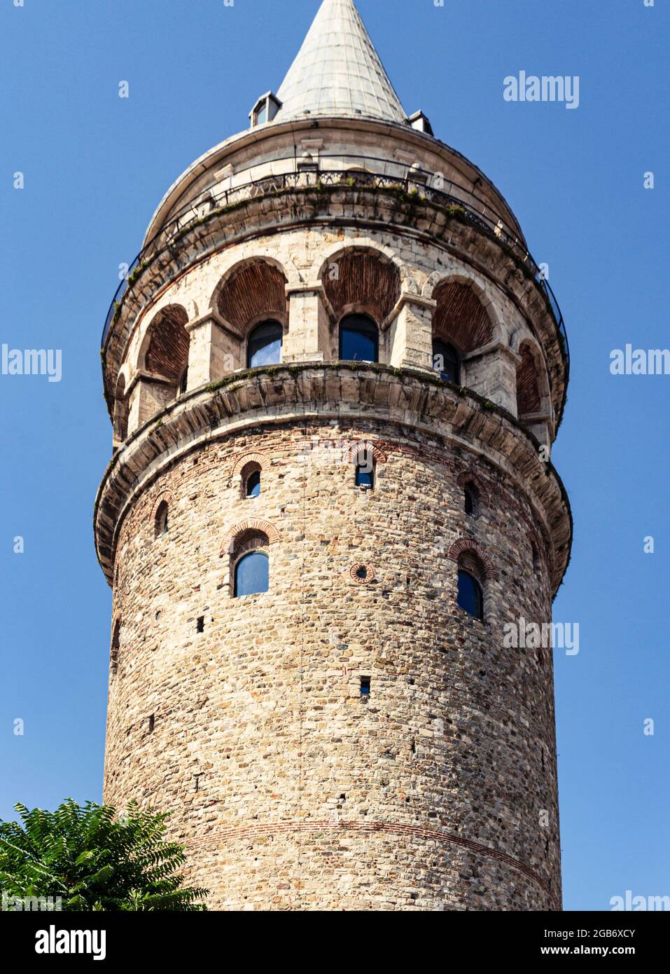Galata Tower in low angle view under blue sky with no people Stock Photo