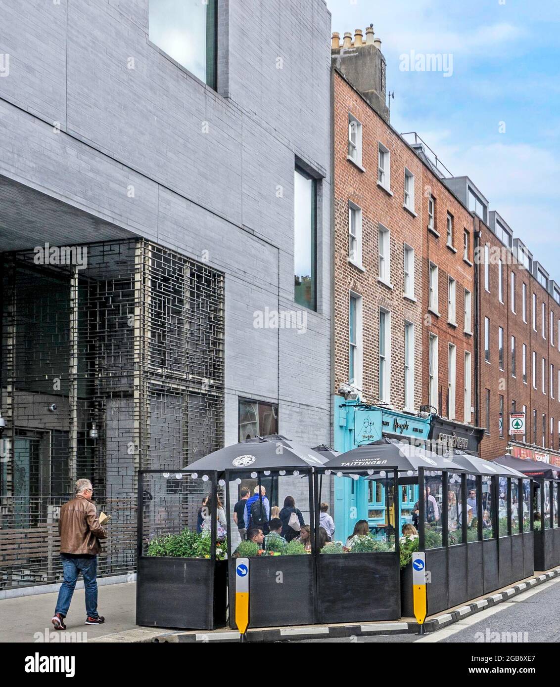 Outdoor dining in Merrion Row in Dublin, Ireland. Parts of the street has been pedestrianised to encourage outdoor dining as  a covid related measure Stock Photo