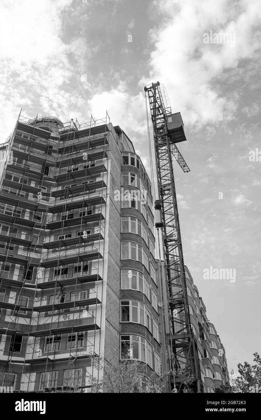 Black and white photo of a multi-storey residential building under ...