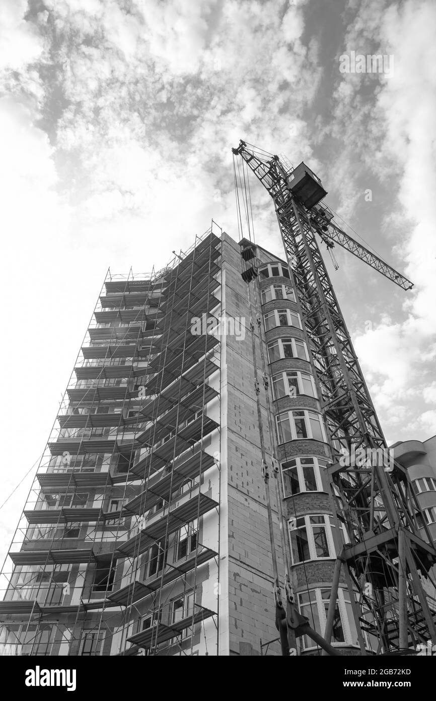 Black and white photo of a multi-storey residential building under ...