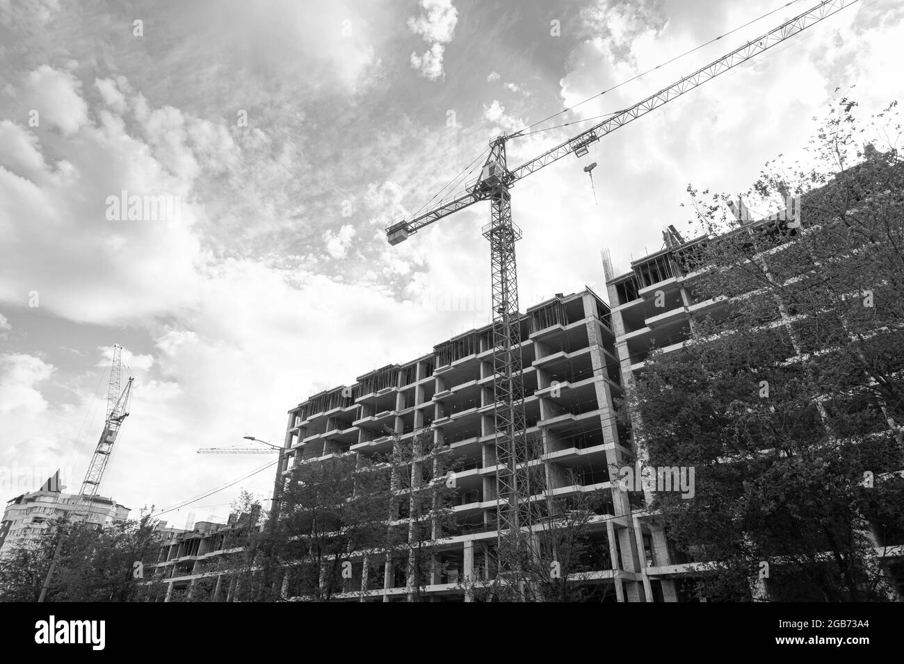 Black and white photo of a multi-storey residential building under ...