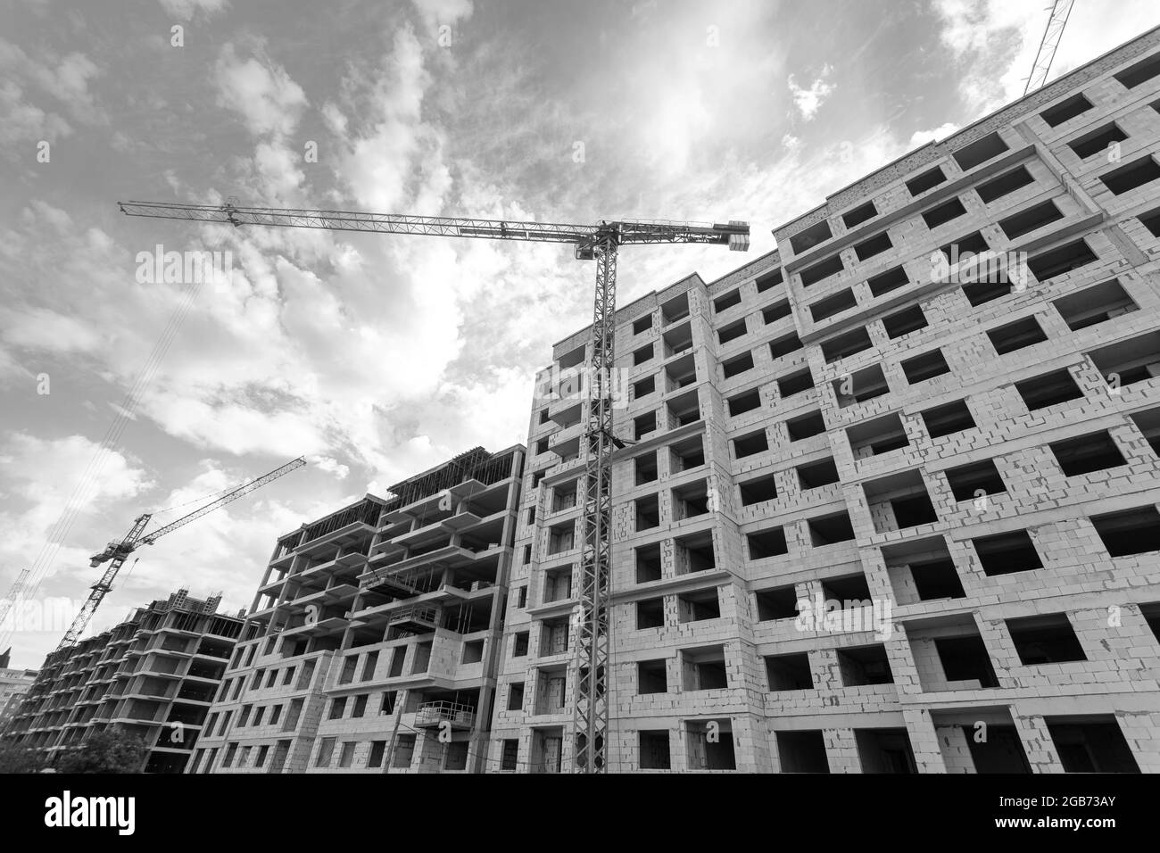 Black and white photo of a multi-storey residential building under ...