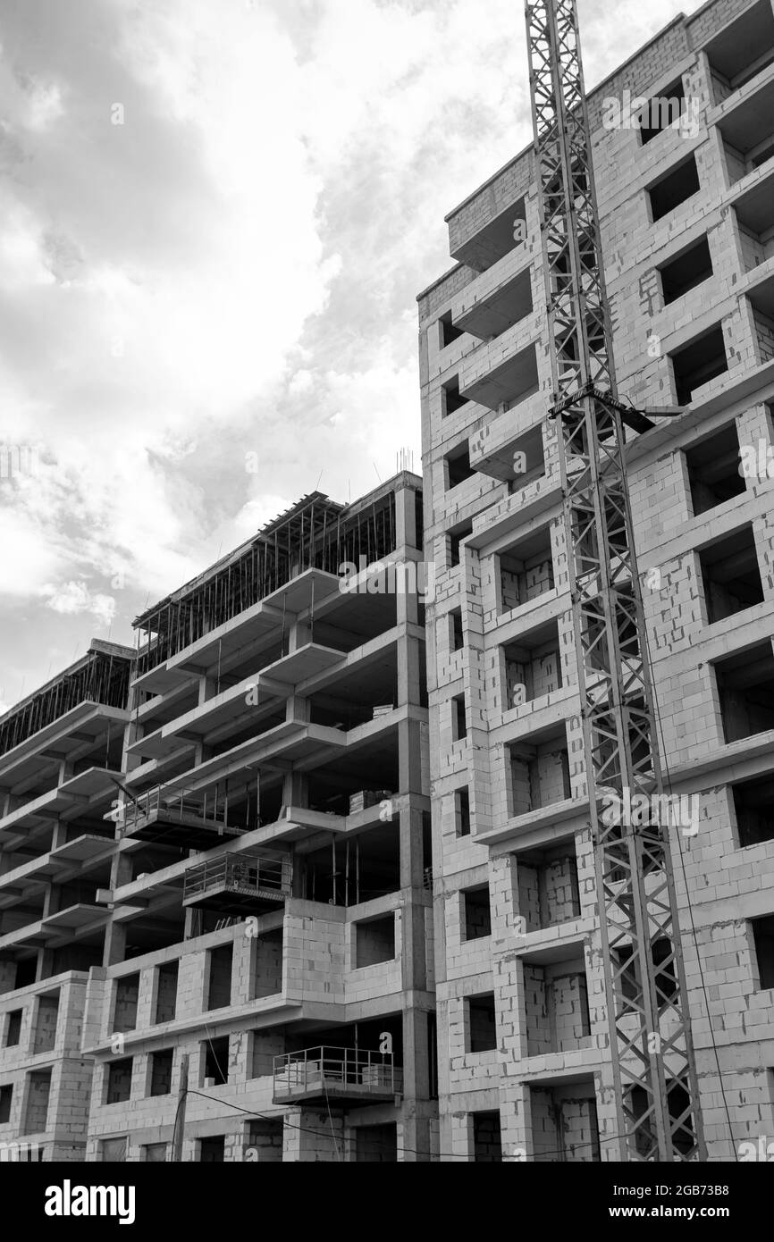 Black and white photo of a multi-storey residential building under ...