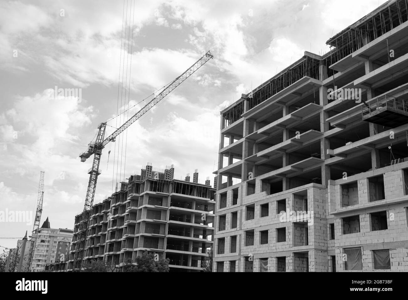 Black and white photo of a multi-storey residential building under ...