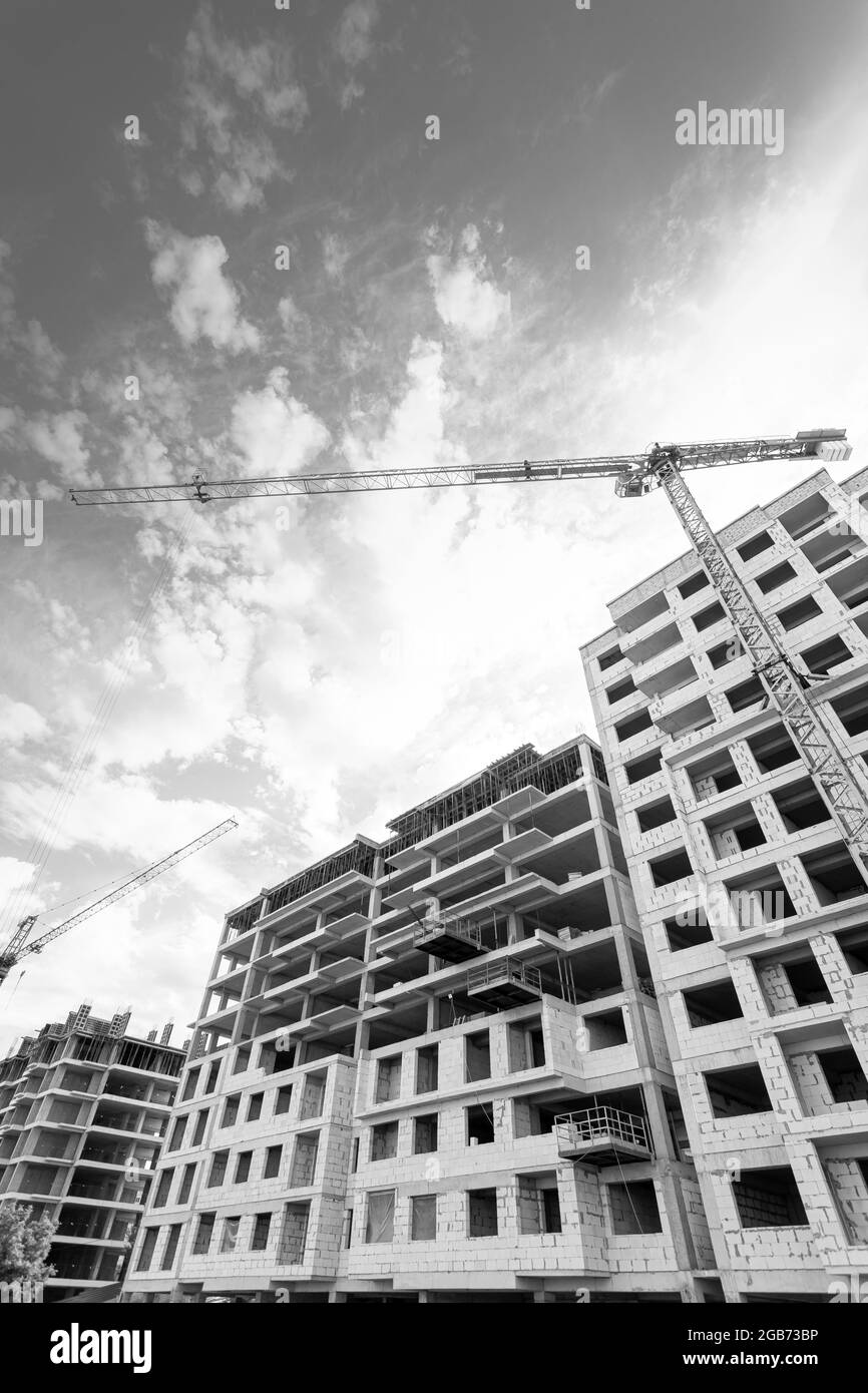 Black and white photo of a multi-storey residential building under ...