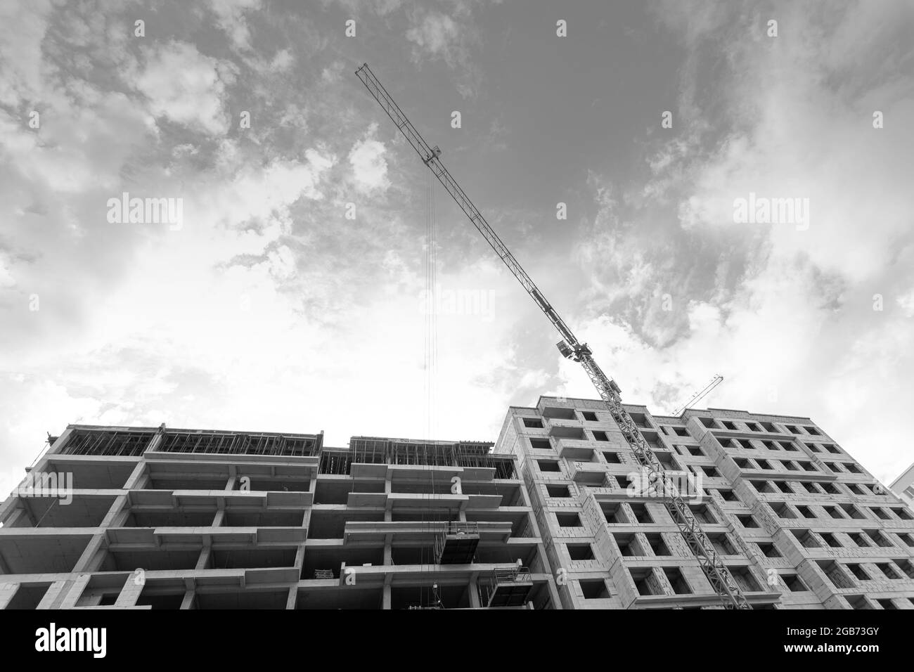 Black and white photo of a multi-storey residential building under ...