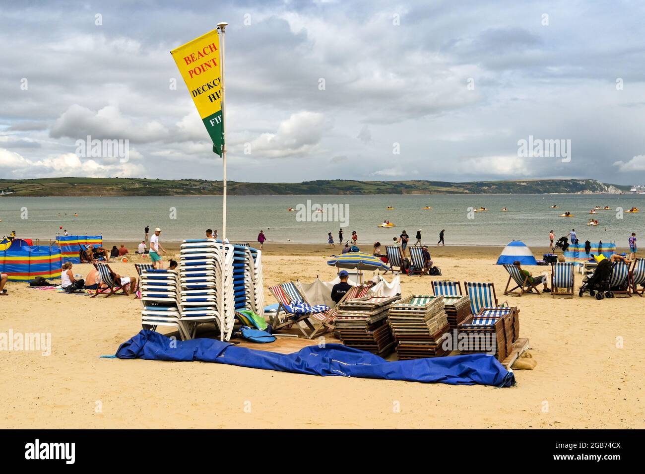 Weymouth, England July 2021 Deckchairs and sunbeds stacked up on the