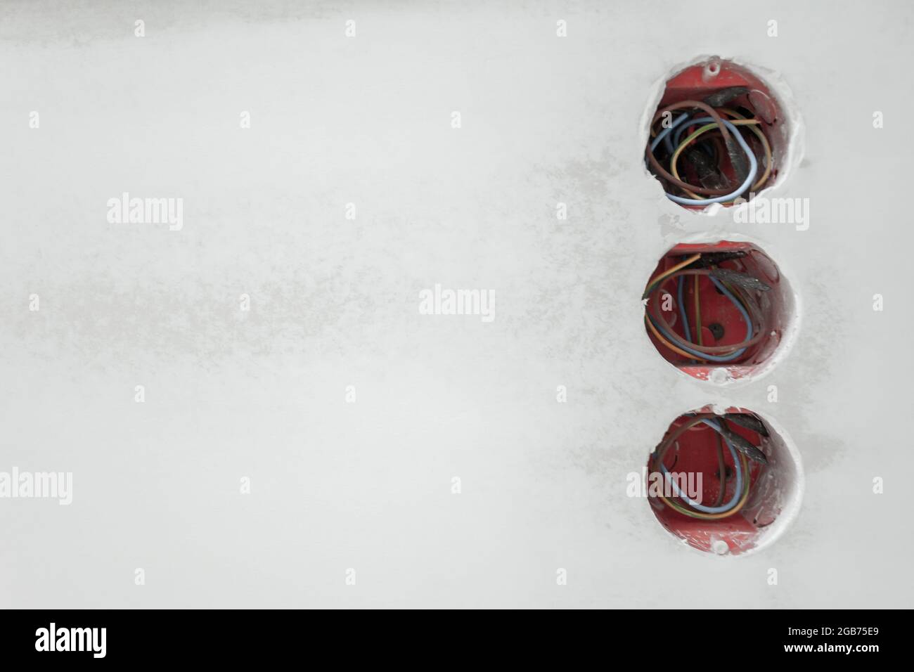 sockets with wires on a putty wall Stock Photo - Alamy