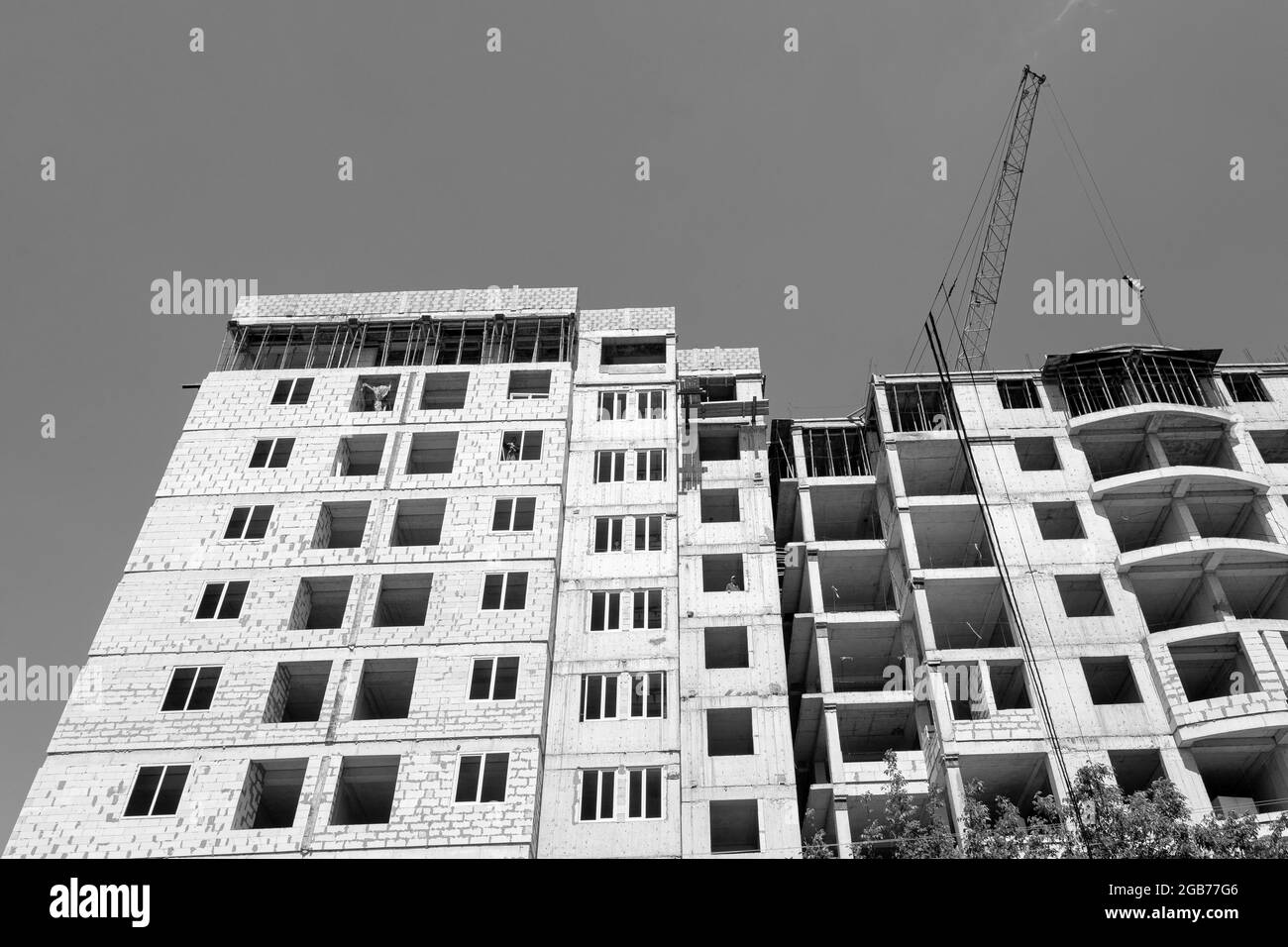 Black and white photo of a multi-storey residential building under ...
