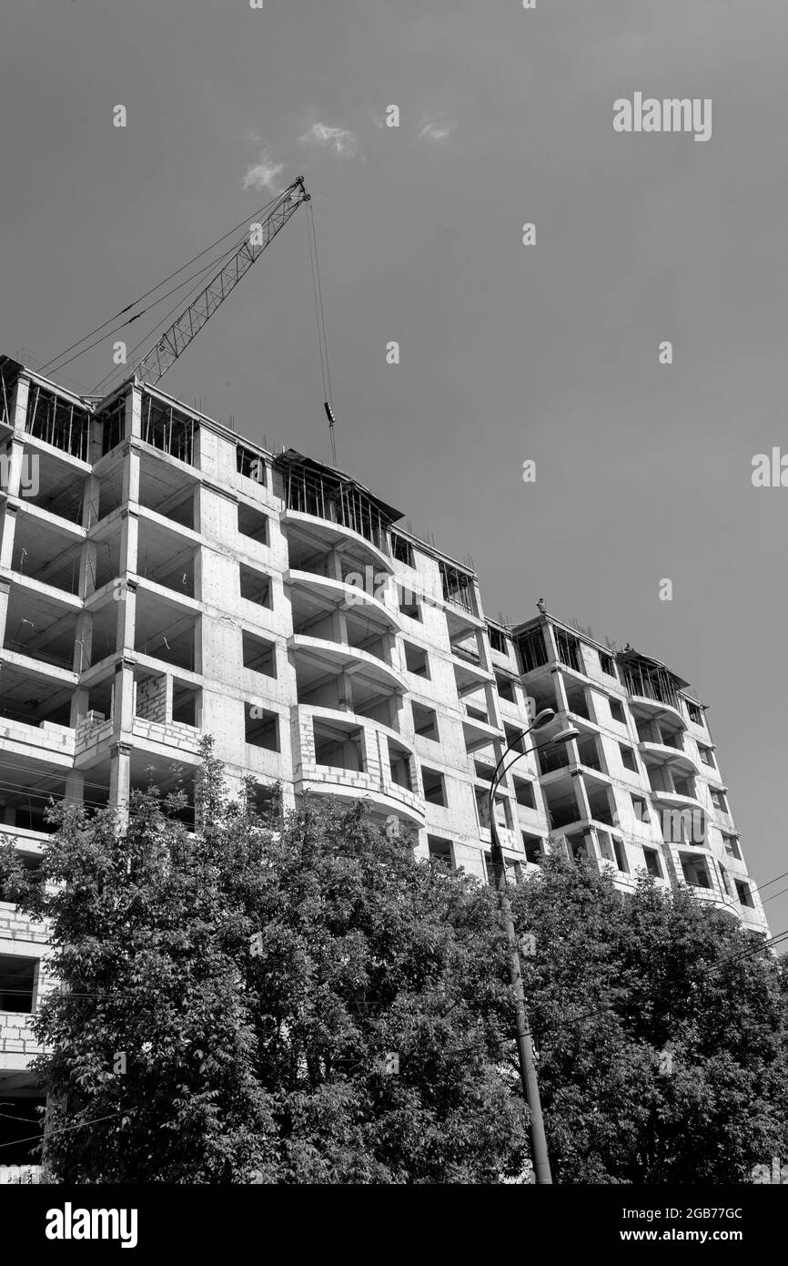 Black and white photo of a multi-storey residential building under ...