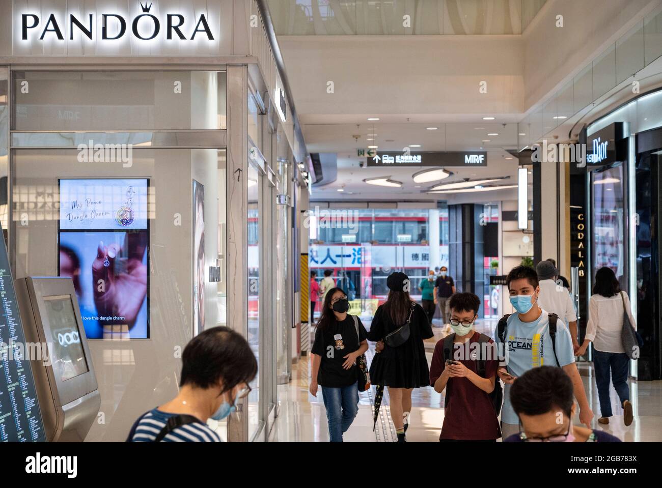 A shopper walks past the French multinational clothing and beauty products  brand Chanel store in Hong Kong (Photo by Budrul Chukrut / SOPA Images/Sipa  USA Stock Photo - Alamy