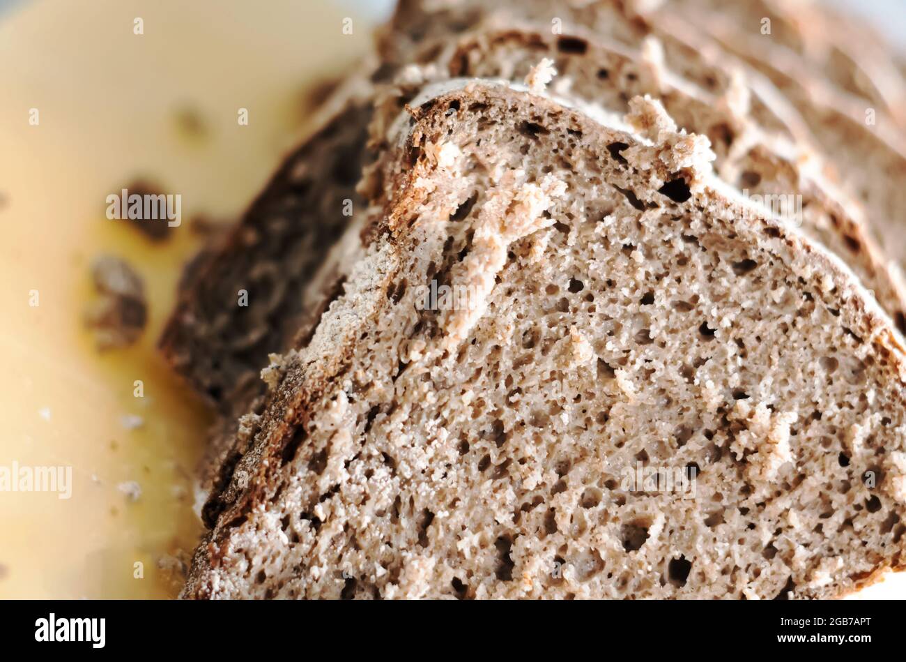 Closeup view of some slices of fresh rye bread. Healthy food and source of fiber. Bakery