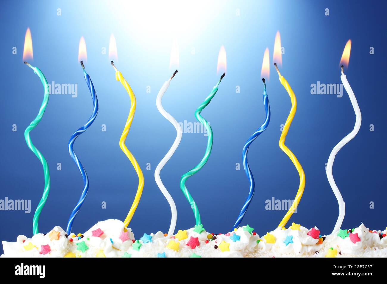 beautiful birthday candles on blue background Stock Photo - Alamy