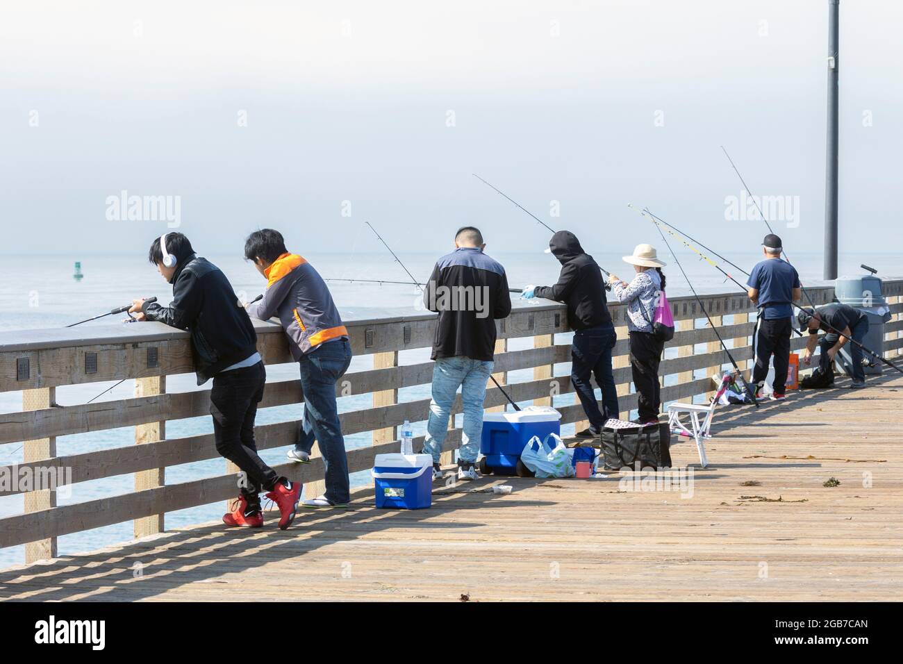Seven People Fishing on Cayucos Pier Stock Photo