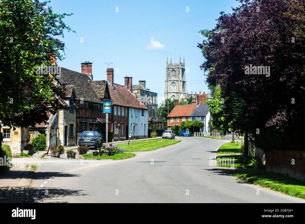 Steeple Ashton was once a market town, having been granted a weekly market in 1266, a market cross (1679) which still stands on the village green. Stock Photo