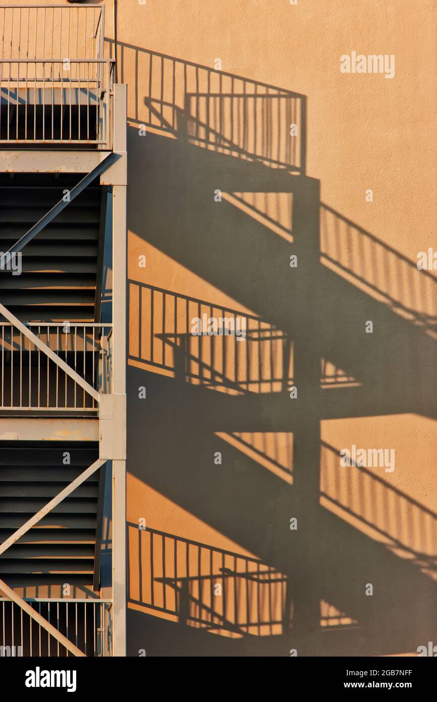 Fire escape, multiple units, shadows resulting from evening light. Stock Photo