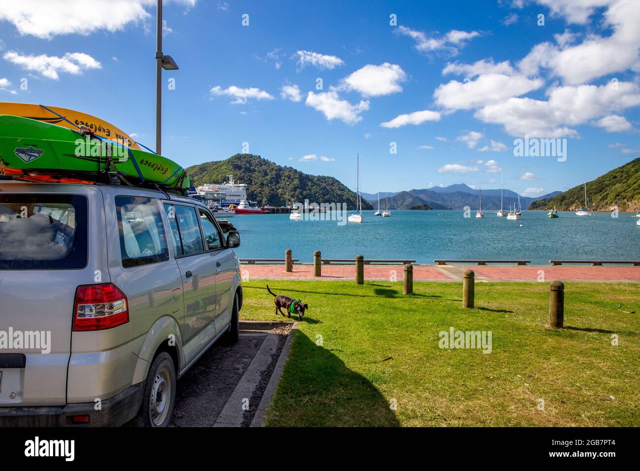 Picton, Marlborough, New Zealand, June 13 2021: Tourists in a campervan enjoy the view along the Picton waterfront while waiting to catch the ferry Stock Photo
