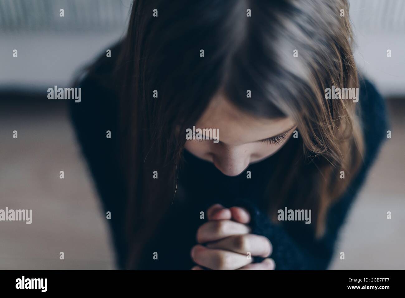 Girl folded hands in prayer hi-res stock photography and images - Alamy